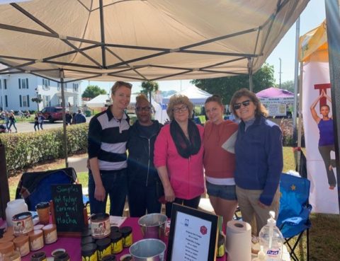 Heather, Loie, Brandi and a client at a farmers market selling hot fudge