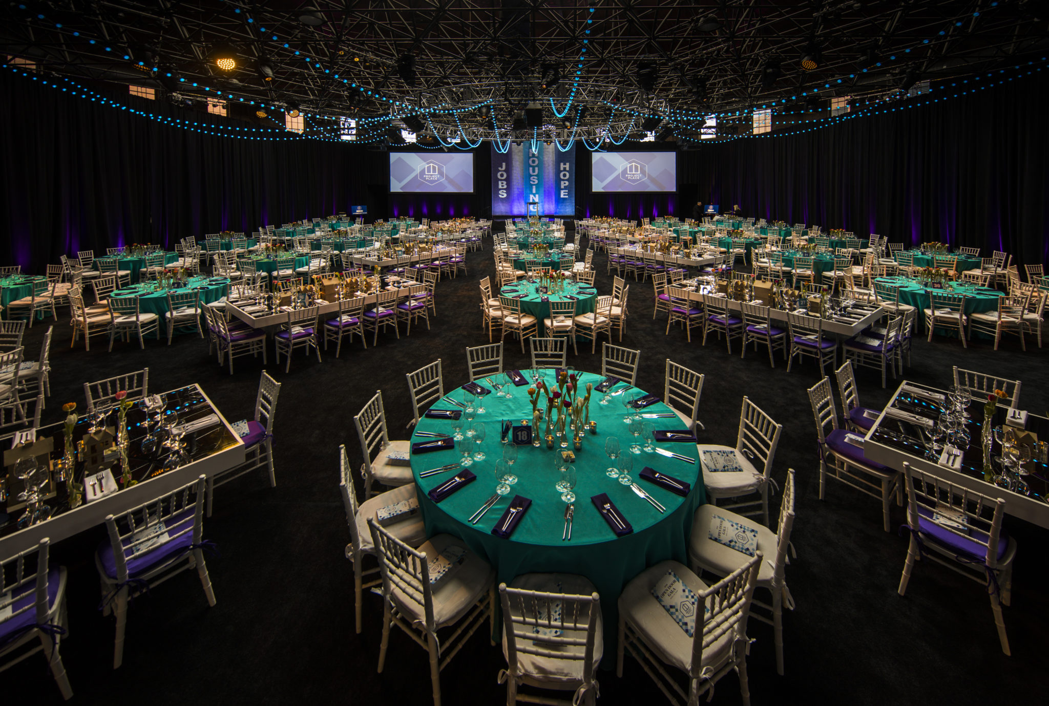 wide shot of our open door gala venue, outfitted with tables and bright decorations